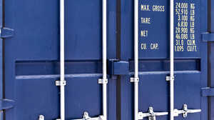 Blue shipping container doors with weight and capacity specifications in yellow text.