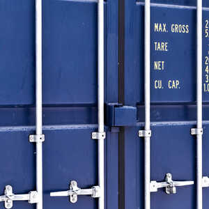 Closed doors of a blue steel shipping container used for storage, with locking bars and capacity markings
