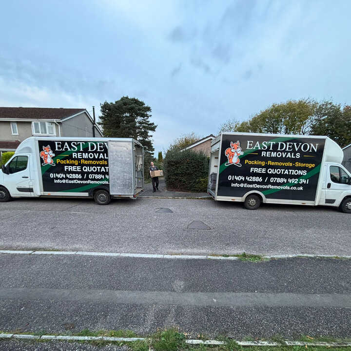 A East Devon Removals van parked on a residential street.