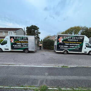 A East Devon Removals van parked on a residential street.