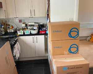 Kitchen packed with moving boxes ready for the Exeter to Cranbrook house move