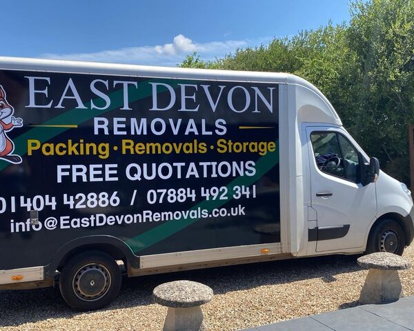 East Devon Removals van parked on the gravel driveway of the customer's new home in Cranbrook